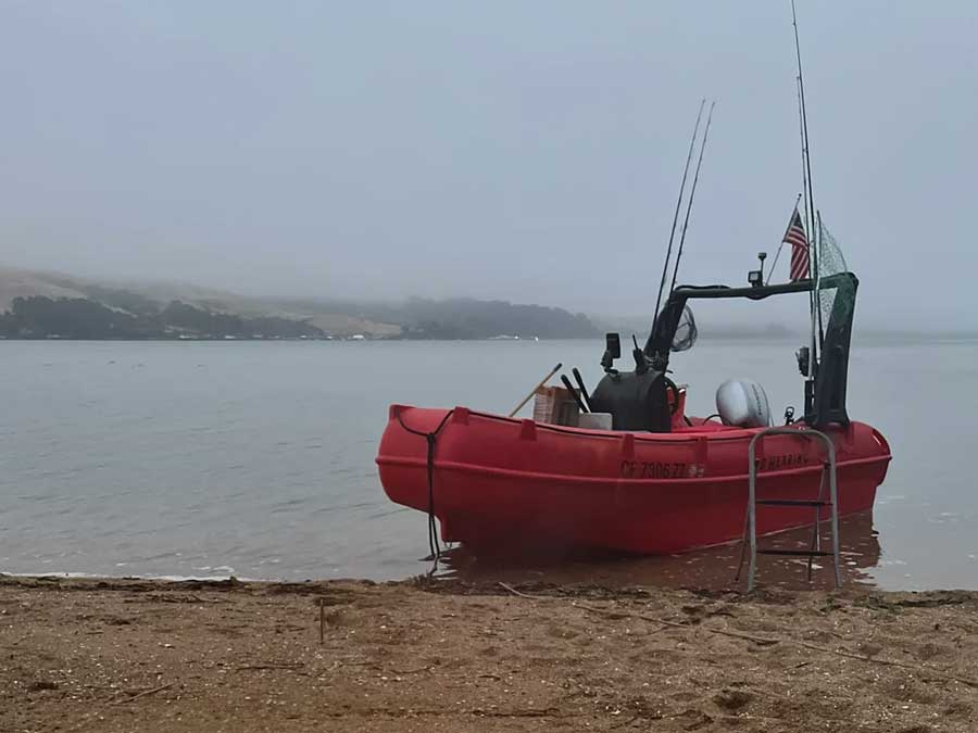 Whaly boat in red on the beach
